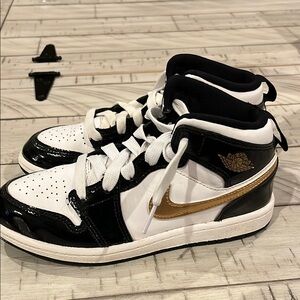 Black and White High-Top Sneakers with Gold Accents